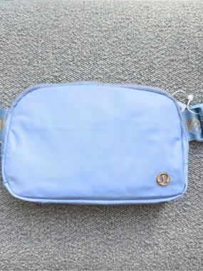 lululemon athletica Light Blue Crossbody Pouch with Gold Logo and Keychain